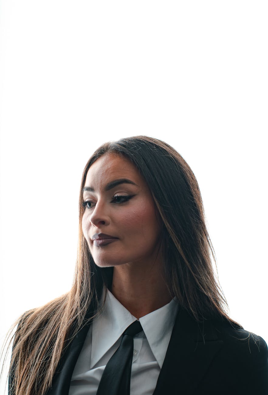 professional woman in black suit with white background